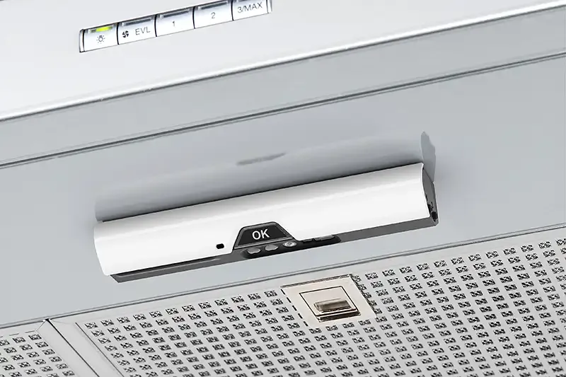 Safera Sense stove guard installed on the bottom of cooker hood