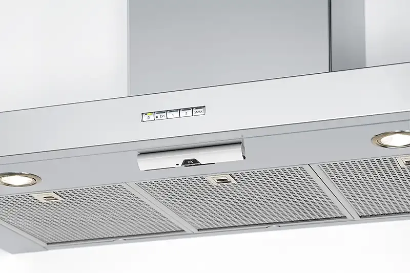 Safera Sense stove guard installed on the bottom of cooker hood